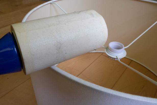 using lint roller to clean lampshade