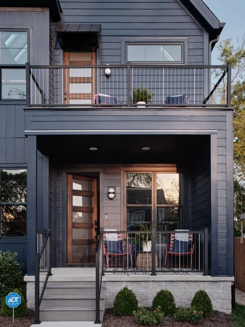 The main level front porch offers a covered seating area for enjoying morning coffee or evening sunsets while the upstairs porch opens off the primary bedroom and creates a birds nest view of the vibrant neighborhood.