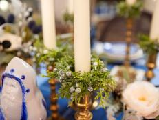 Give your everyday taper candles a holiday makeover in just a few minutes by dressing up plain napkin rings with hot glue and faux evergreens.