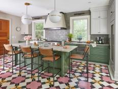 Colorful Kitchen With Green Cabinets and a Patterned Floor