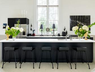 Contemporary White Kitchen With Black Waterfall-Edge Island 
