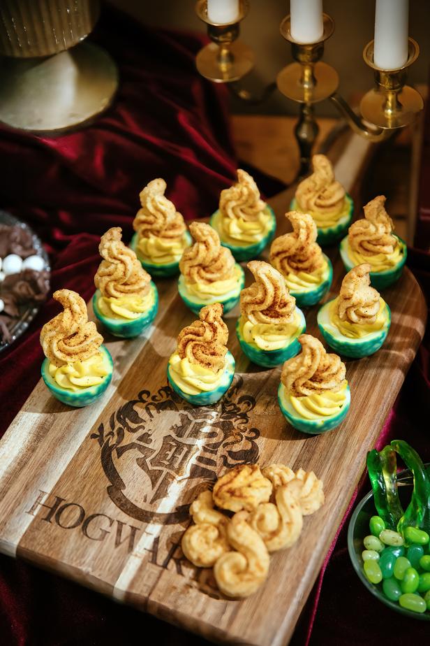 Deviled Eggs Sitting on Top of Wooden Cutting Board 