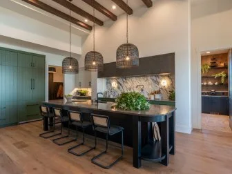 Team Jonathan Knight and Kristina Crestin's finished kitchen features ceiling beams and a long, rounded edges island, as seen on Rock the Block, Season 4. (After, Matches Kitchen Before 0006)

