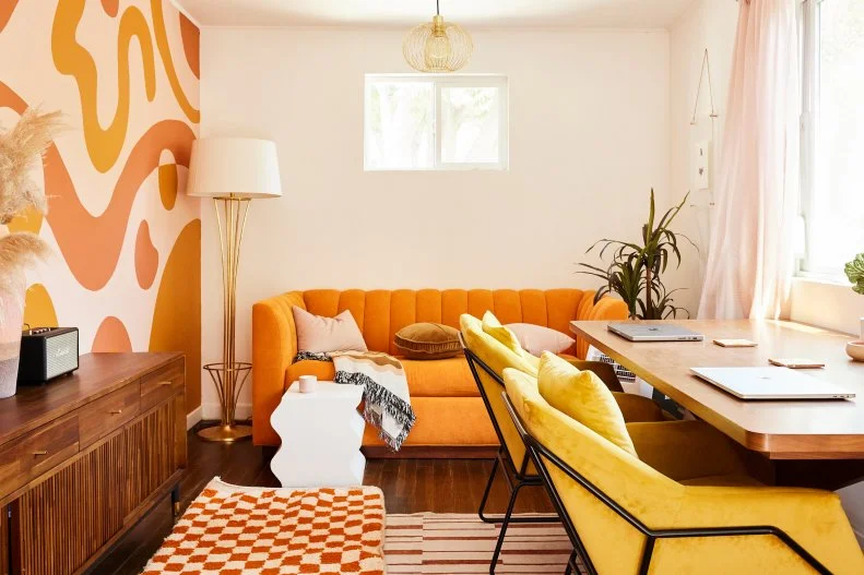 Orange and White Living Area With Orange Sofa, Gold Floor Lamp