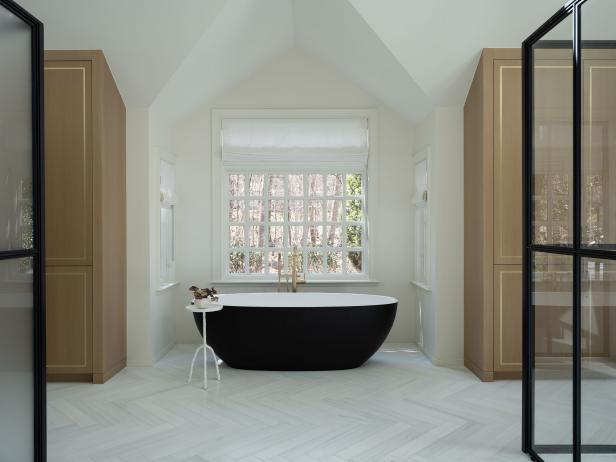 Contemporary White Bath With Vaulted Ceiling and Black Soaking Tub 