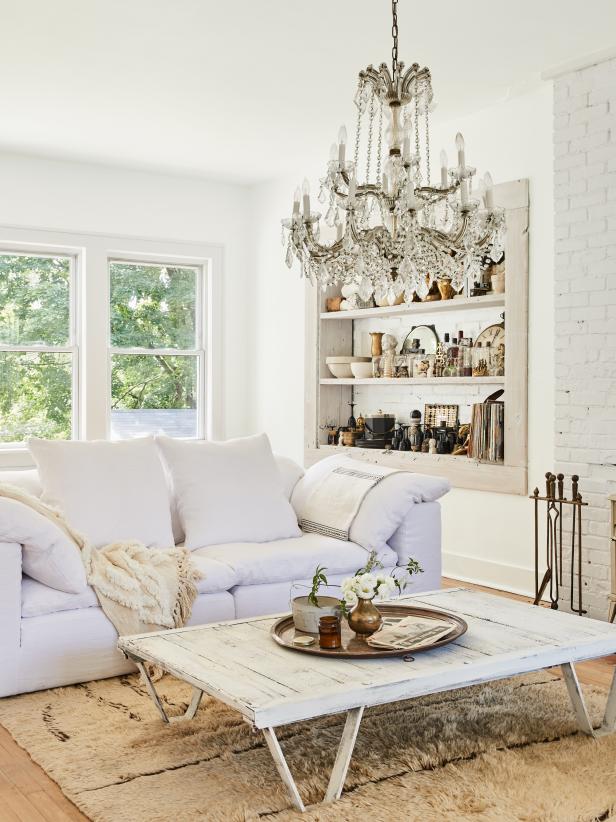Chic White Living Room With a Crystal Chandelier