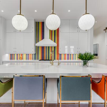 Kitchen With Rainbow Backsplash and Barstools