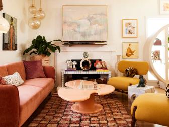 Eclectic Living Room With Peach Sofa, Yellow Armchairs and Vintage Accessories 