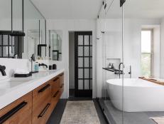 A White Spa Bathroom With a Warm Walnut Vanity