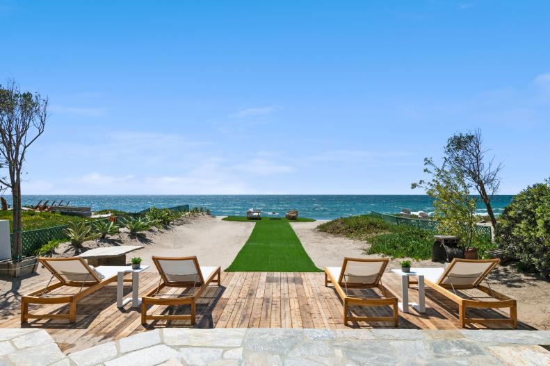 Wooden Patio on the Beach With Lounge Chairs