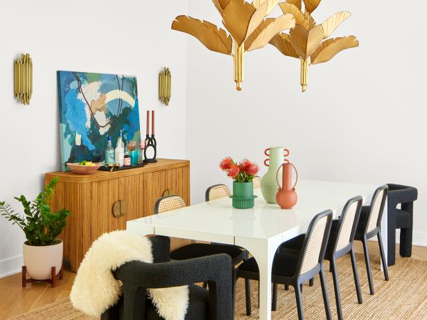 White Midcentury Modern Dining Room With Statement Lighting