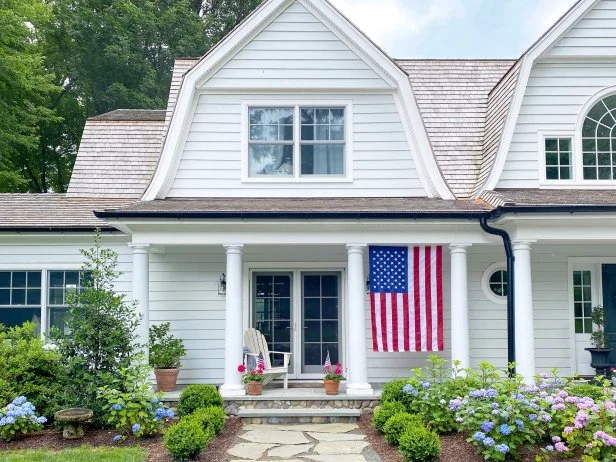 White House With a Flag Hanging on the Front Porch