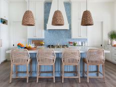 Blue and White Coastal Kitchen With Woven Pendants