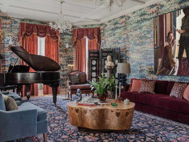 Maximalist Victorian Living Room With Floral Rug and Oversized Art
