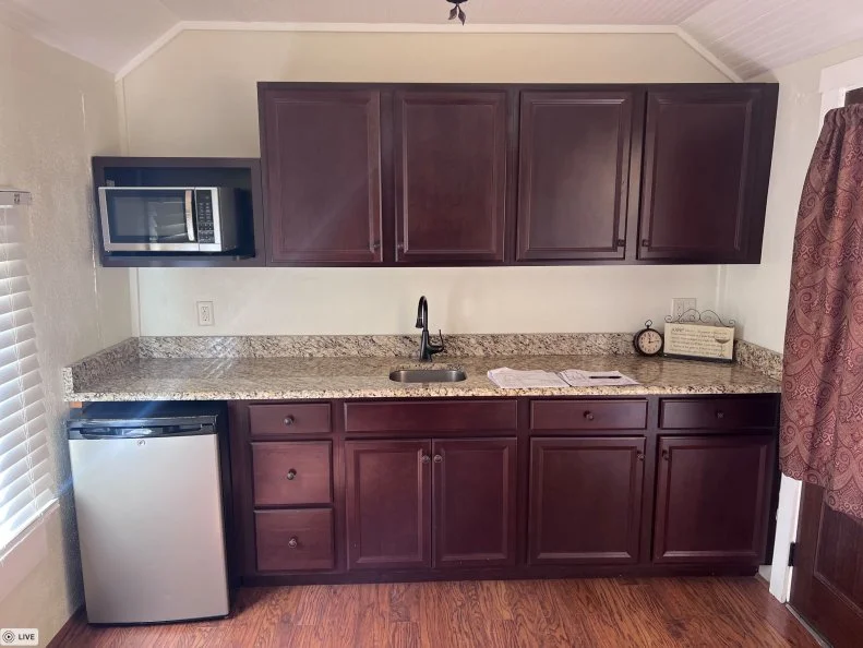 Prior to the renovation, this kitchenette was functional but needed better-fitting appliances and a bigger sink.