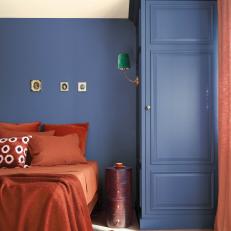 Denim Blue Bedroom With Rust-Colored Accents