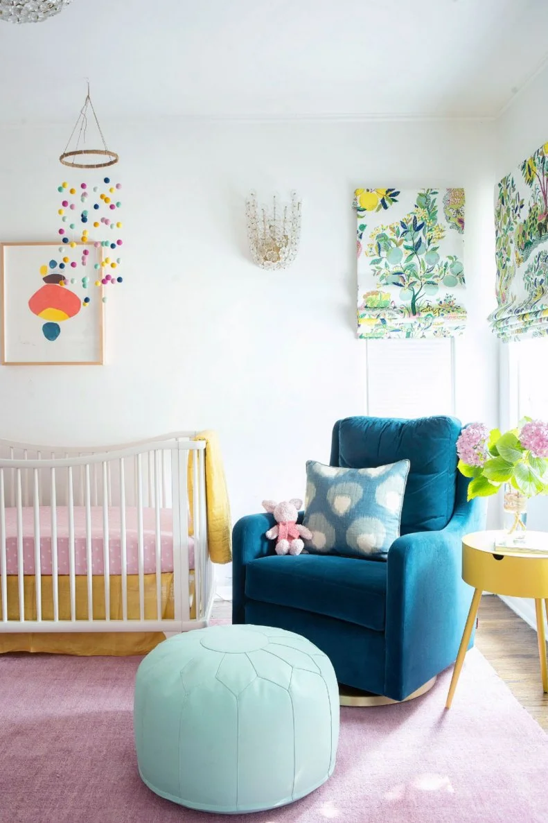 Multicolored Nursery With Blue Pouf