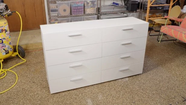 Jenna Pilant transformed this plain, thrifted dresser by adding dimensional detail, repainting it vivid green, and swapping out the cheap handles for brass ones.