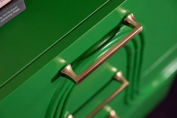 A simple swap like these new brass handles lends the dresser a bit of vintage richness; the half-inch, half-round flexible molding (which designer Jenna Pilant nails in place to create an ultra-graphic design she'll eventually paint over) pumps up the dresser's midcentury style even more.