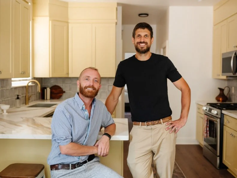 Host Keith Bynum and Evan Thomas pose for a group shot for the Mardi Gras kitchen, as seen on Bargain Block New Orleans, Season 1.