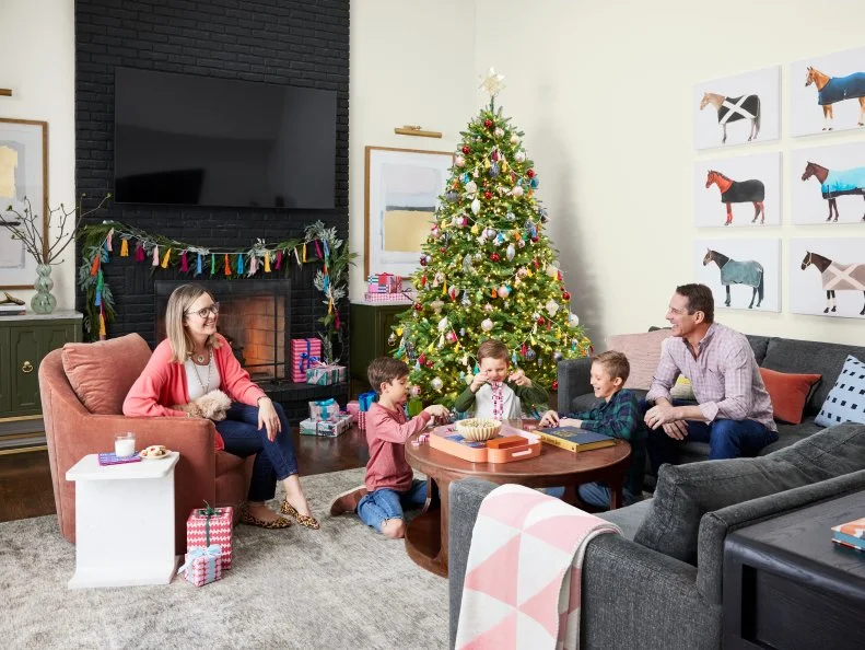 Family Room With Black Fireplace, Horse Wall Art and Holiday Decor