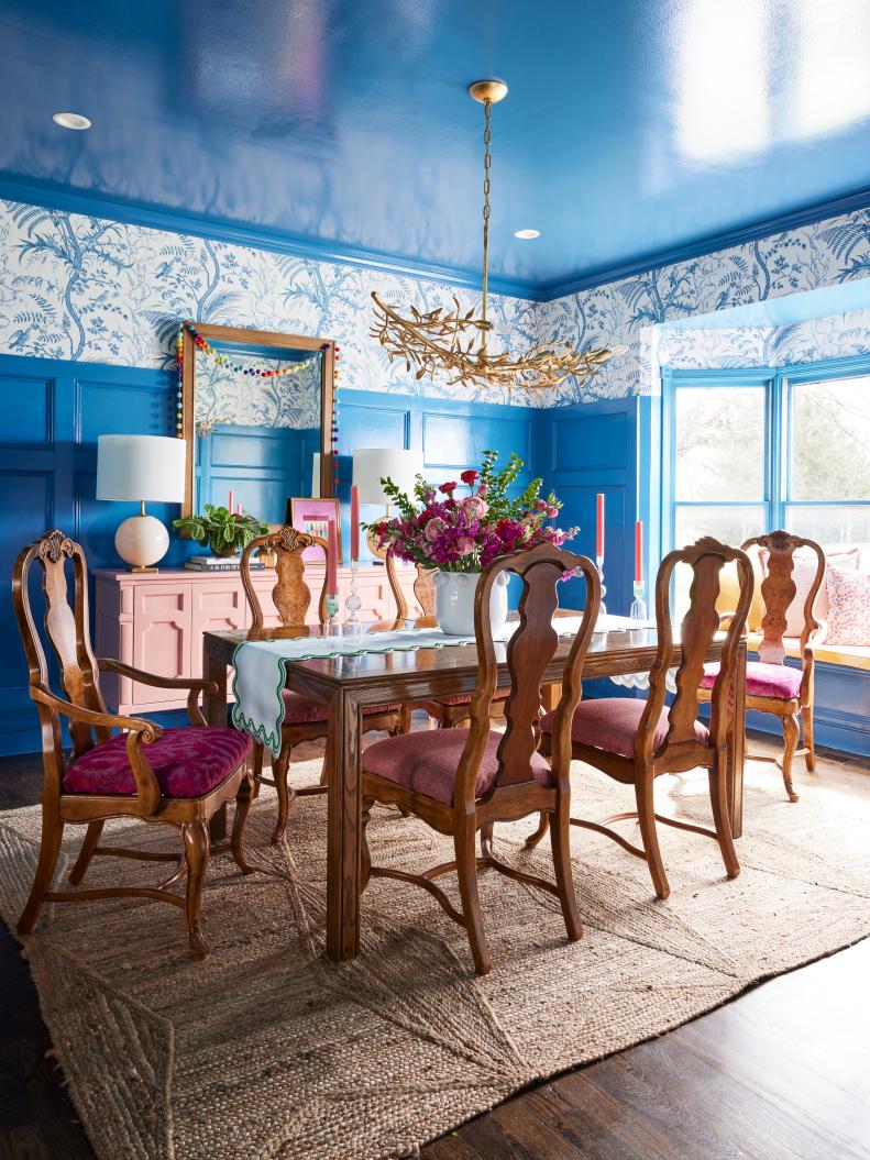 Bright Blue Dining Room With Wallpaper and a High Gloss Ceiling