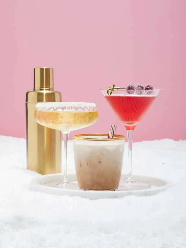 Three Winter Holiday Drinks With a Gold Cocktail Shaker