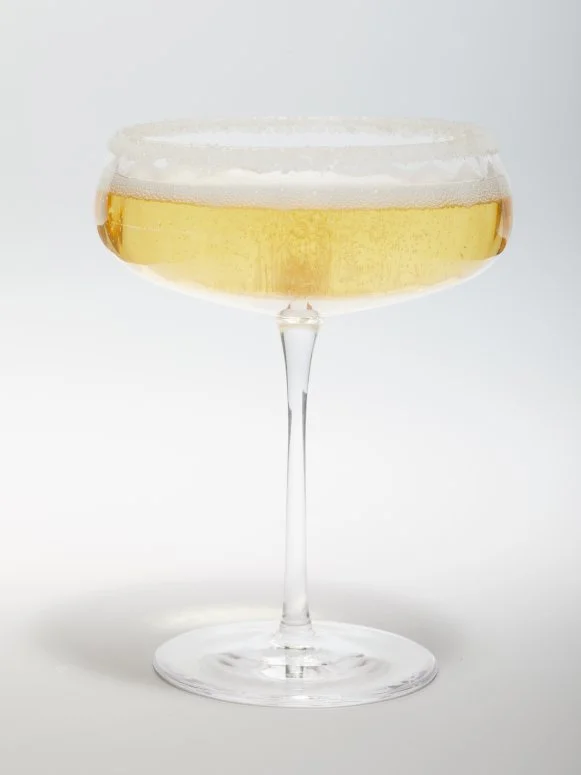 Champagne Drink in a Coupe Glass With a Sugared Rim