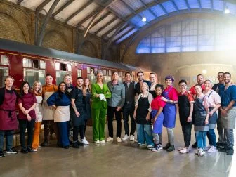 Judges Carla Hall and Jozef Youssef with Contestants Riccardo Meniccuci, Hemu Basu, Kayla Giddings, Yohann Le Bescond, Kimberly Adams, Ashley Cardona, Juan Gutierrez, Elizabeth Rowe, Zoe Burmester, Jordan Pilarski, Jessica Lewis, Jamie Louks, Miko Kaw Hok Uy, Chris Teixeira, Mitzi Reyes, Lisa Altfest, Conner Strackman, and Michael Russ II at Platform 9æ, as seen on Harry Potter: Wizards of Baking, Season 1.