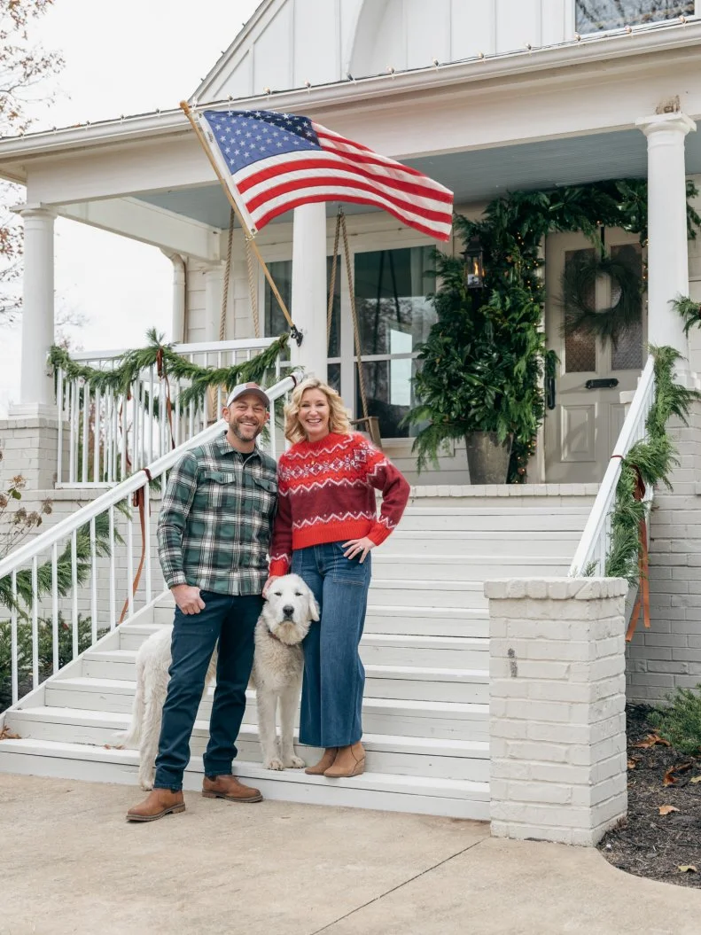 Hosts Dave and Jenny Marrs pose on front porch, as seen on Fixer to Fabulous Holiday Social Project on HGTV.