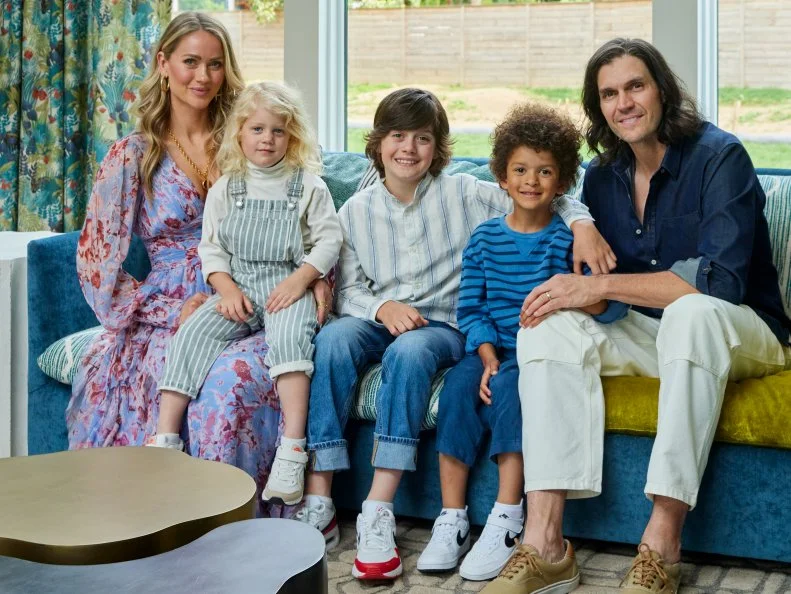 Family on a Blue Sofa in an Eclectic Living Room