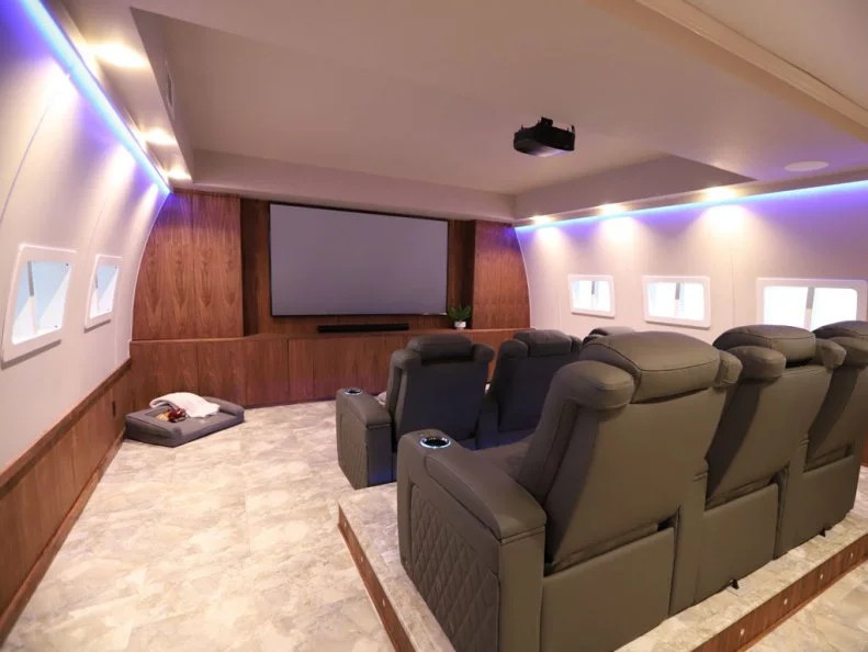 A look at the airplane themed media room after the renovation is complete, as seen on Lil Jon Wants to Do What?, Season 2.