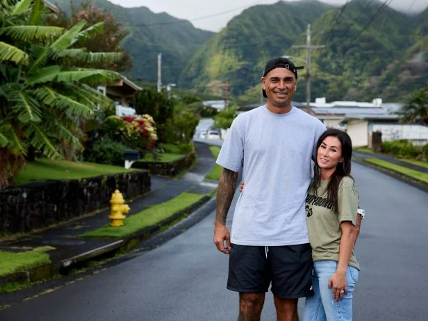 Hosts Kamohai & Tristyn Kalama portrait shot on the road next to the Manoa house, as seen on Renovation Aloha, Season 1.