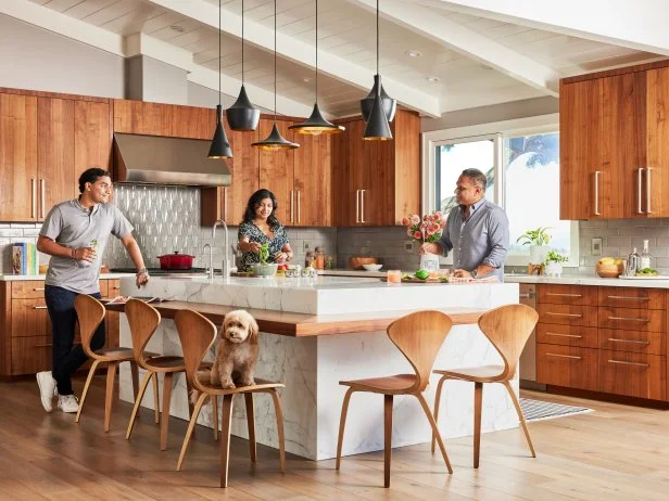 Family Prepping Dinner in Contemporary Kitchen With a Marble Island