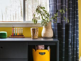 Kid's Bedroom with Yellow Walls and Dark Blue Desk