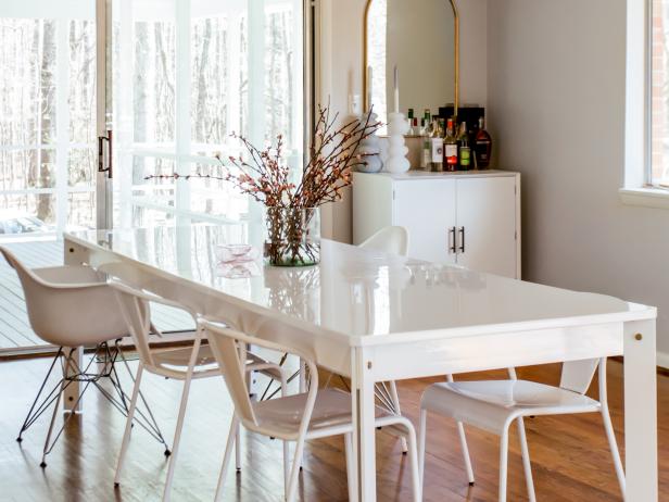 Kitchen with White Table and White Mismatched White Chairs 