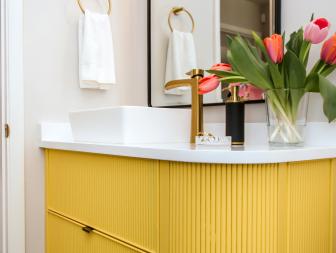 Guest Bathroom with White Countertops and Yellow Cabinet
