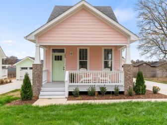 Pink House With Mint Front Door and a Scenic Porch
