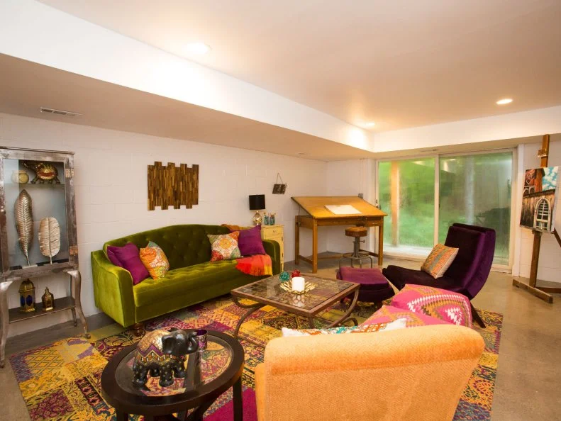 As seen on HGTV's Property Brothers, after the renovation, the basement in Suzanne and Kevin's new home in Pound Ridge, NY, has sealed concrete floors and is styled with a mix of industrial, modern and vintage pieces. A drafting table provides a place for the couple's two daughters to paint, and a custom mural provides inspiration.