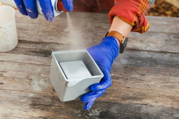 Spray the inside of the large container and the outside of the small container with non-stick cooking spray. If using a silicone mold, spray the entire inside.