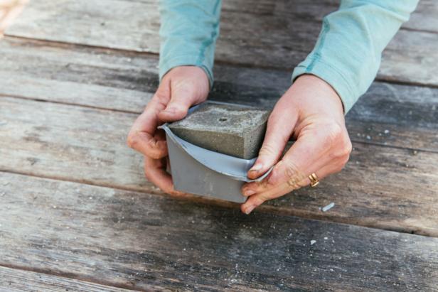 Peel the silicone mold away from the concrete planter.
