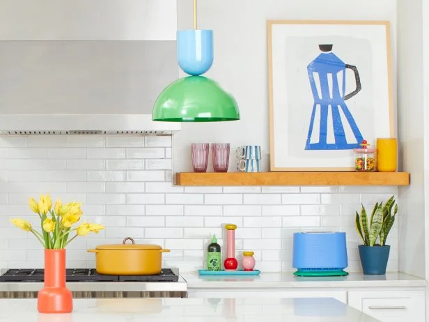 White Kitchen Countertop and Shelves With Multicolor Accessories