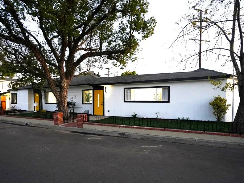 Reveal of the front of the home, as seen on Backed By The Bros.