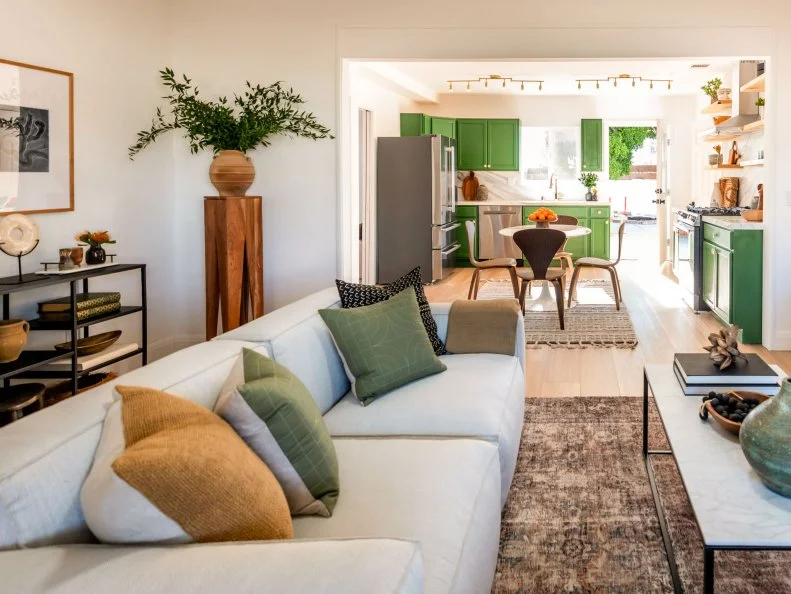 Reveal of the living room with a view of the kitchen, as seen on Backed By The Bros, Season 1.