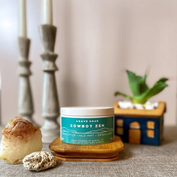 Agave Haus founder Raj'ae Ross is inspired by her Texas roots and her father's love for classic Western films, Houston rodeos, and Black cowboys as she formulates the perfect Texas-inspired scents in the form of hand-poured soy candles. Cowboy Zen blends eucalyptus, wild mint and sandalwood.  