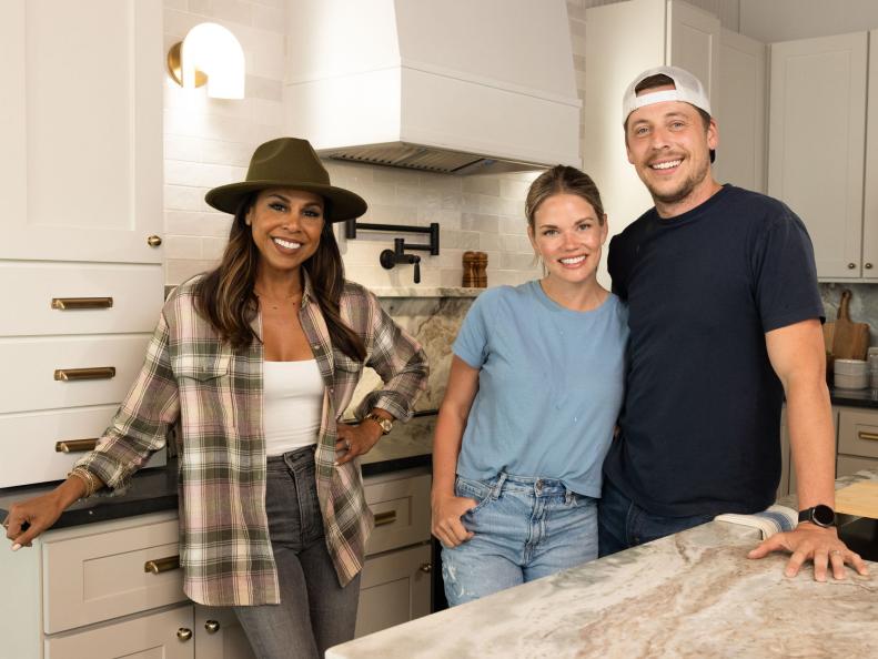 Mentor Taniya Nayak poses with her team of Sam and Sean Kilgore in their renovated kitchen, as seen on Battle on the Beach, Season 4.