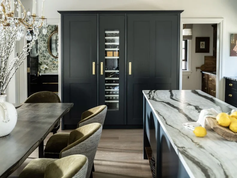 View of Cabinet and Wine Fridge From Kitchen Table and Island