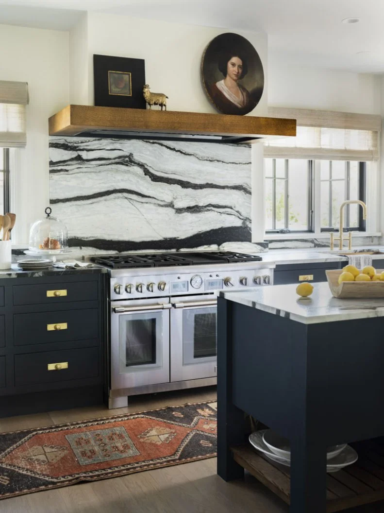 Marble Backsplash and Floating Shelf Paired With Cooking Range