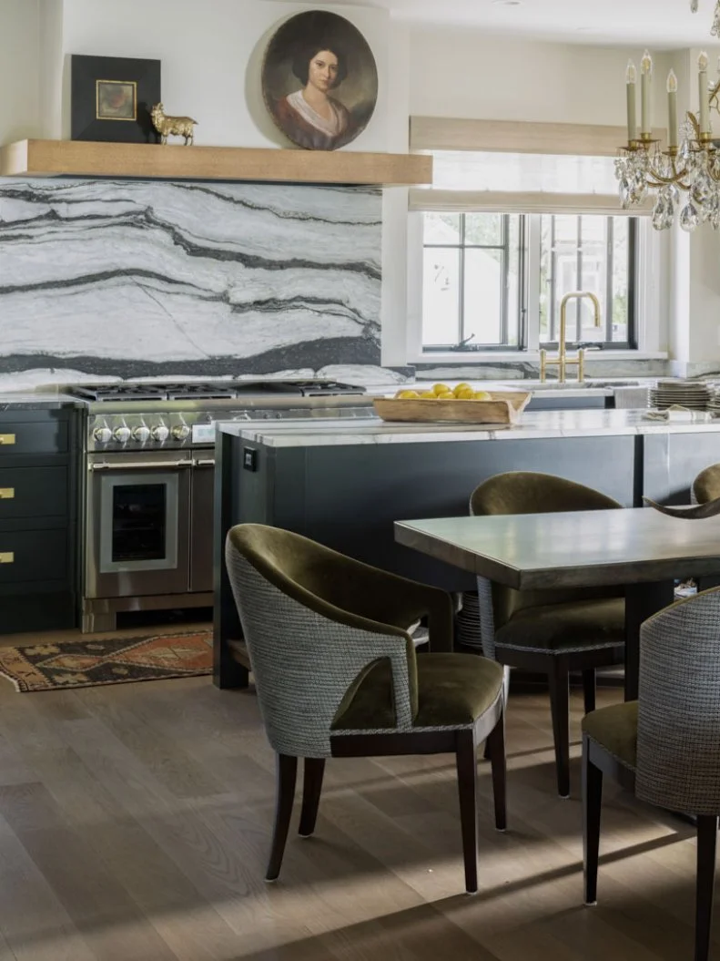 Upholstered Armchairs at Table in Front of Kitchen Island