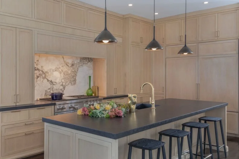 Large Kitchen Island With Black Countertop and Barstools